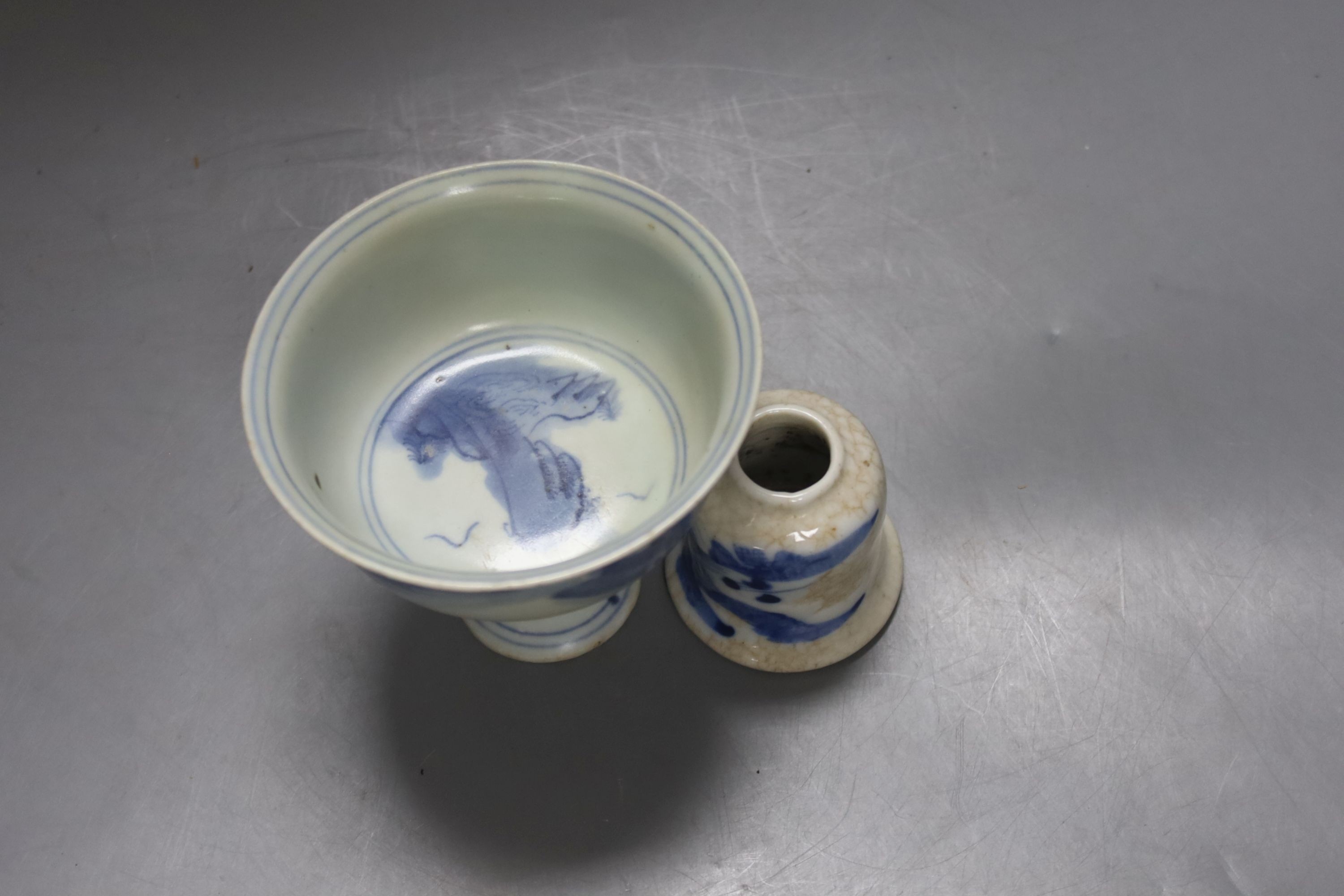 A Chinese stem cup and blue and white brush pot, cup 9 cms high.